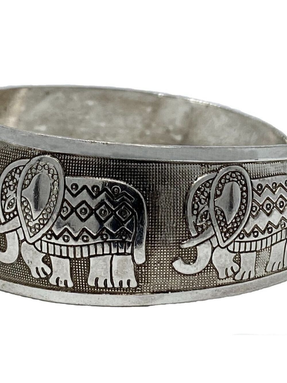 Chunky silver bracelet with marching elephants